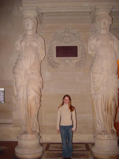 Amanda between 2 statues